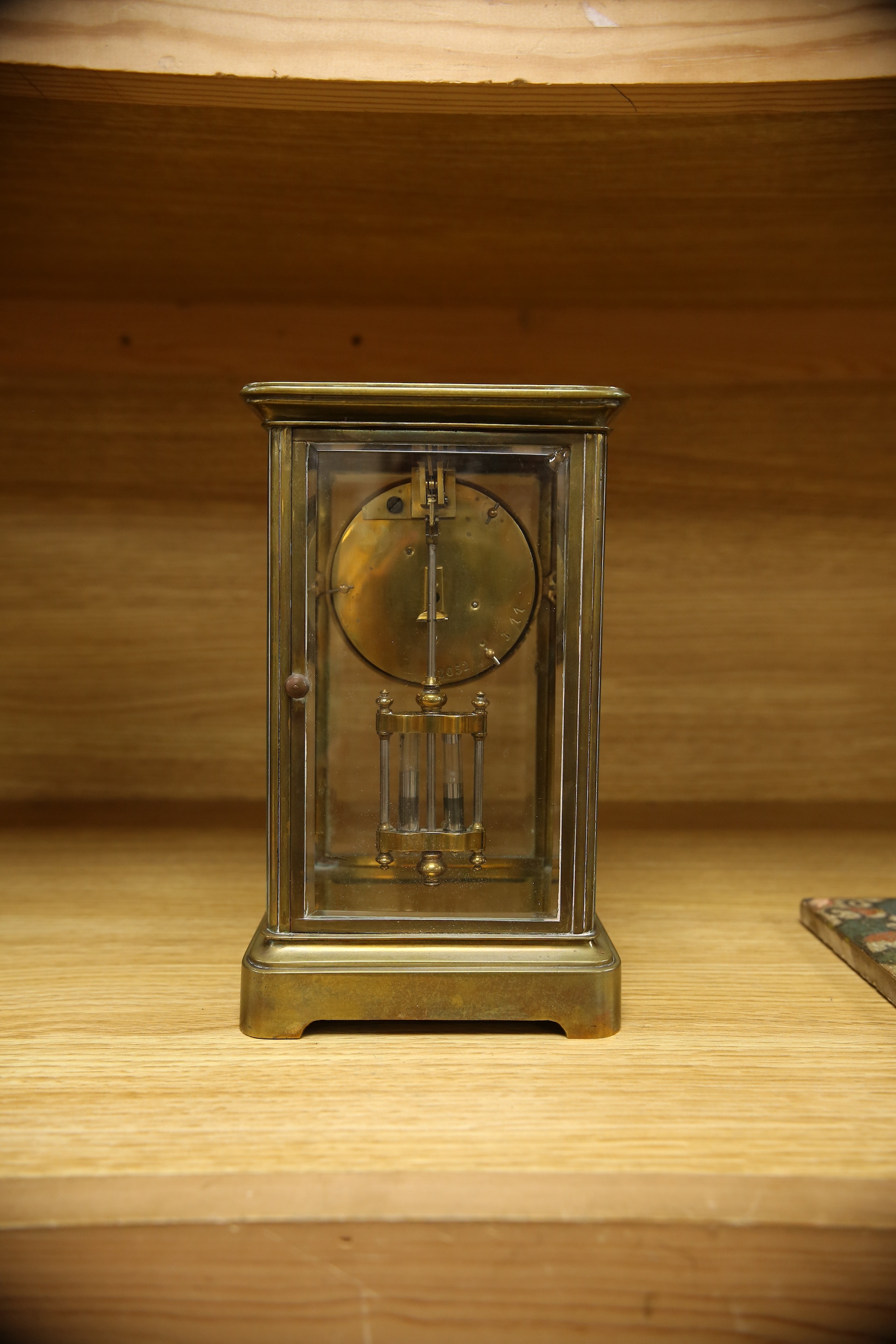 An early 20th century brass four glass mantel clock, 22cm. Condition - fair, not tested as working